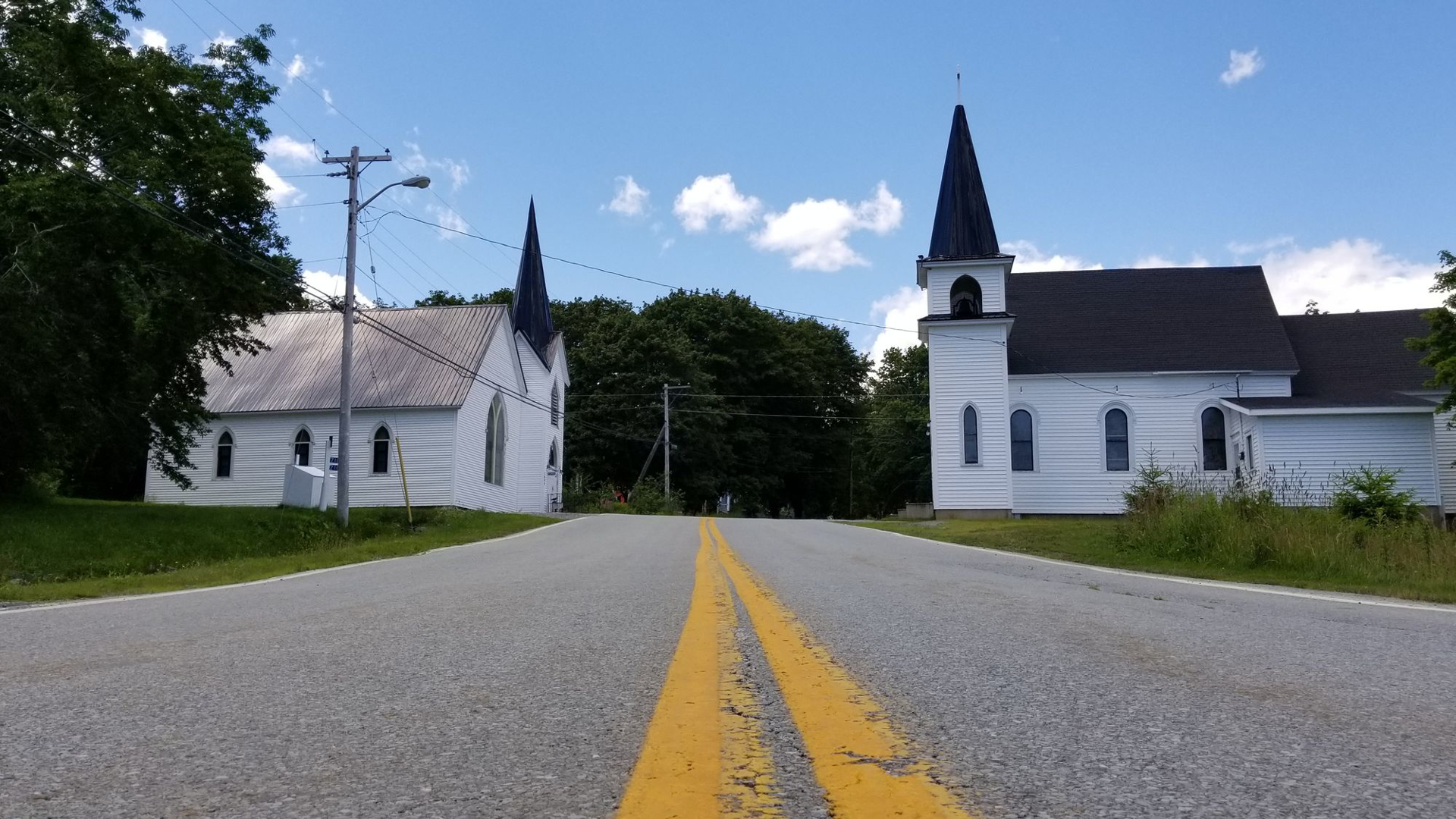 Mount Olive Lutheran Church, a white church beside a road
