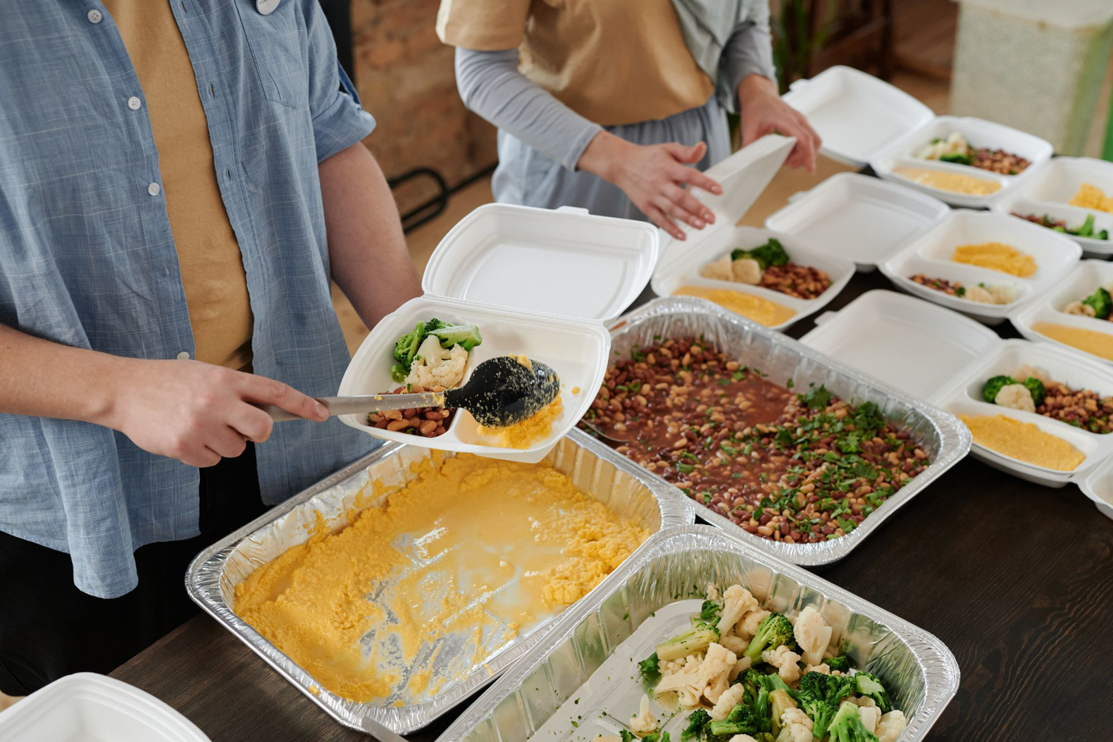 Volunteers sharing a meal around a table