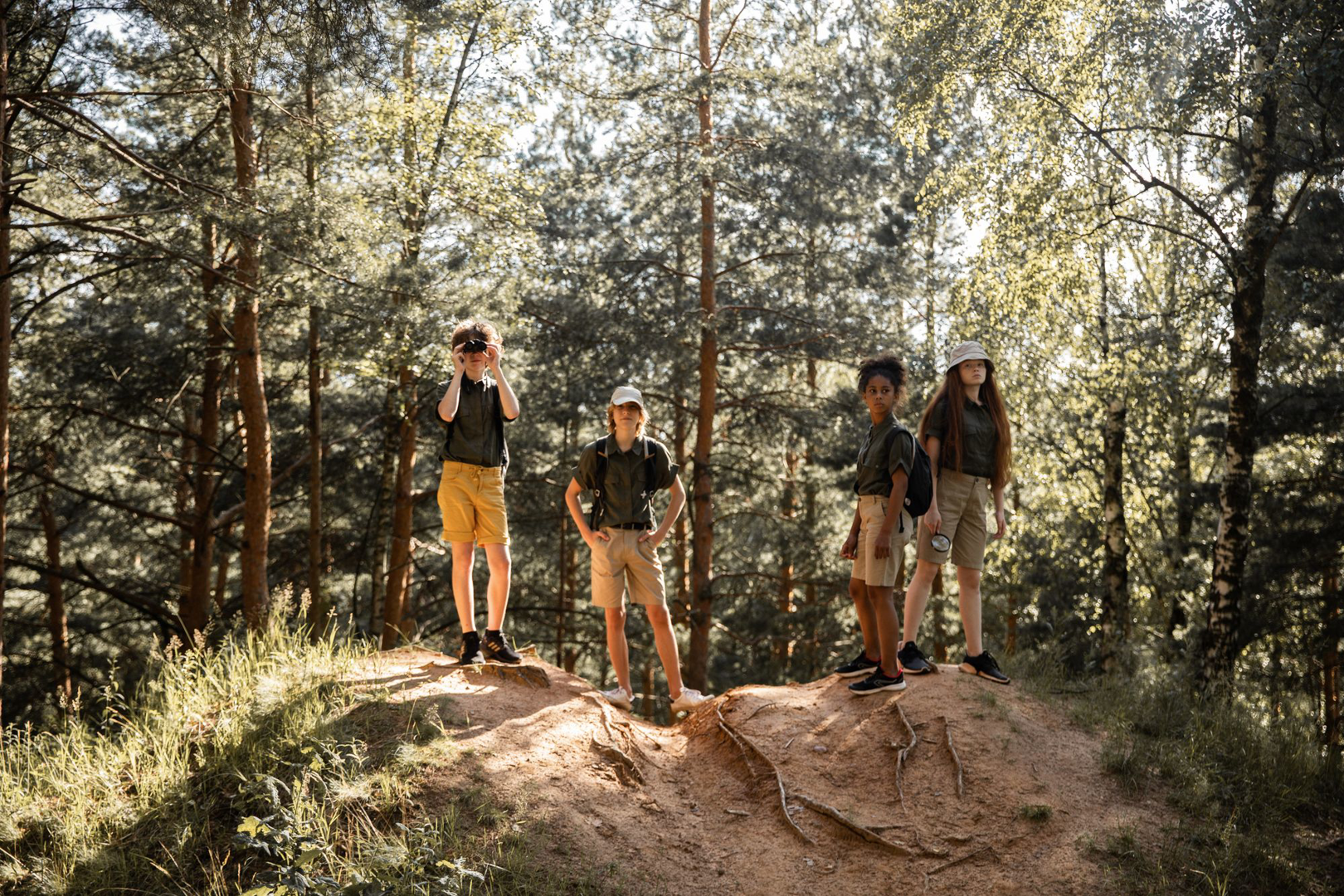 Youth standing together on a rocky overlook