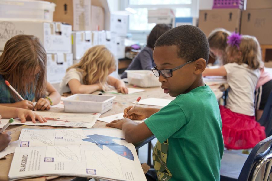 Children working together at a classroom table