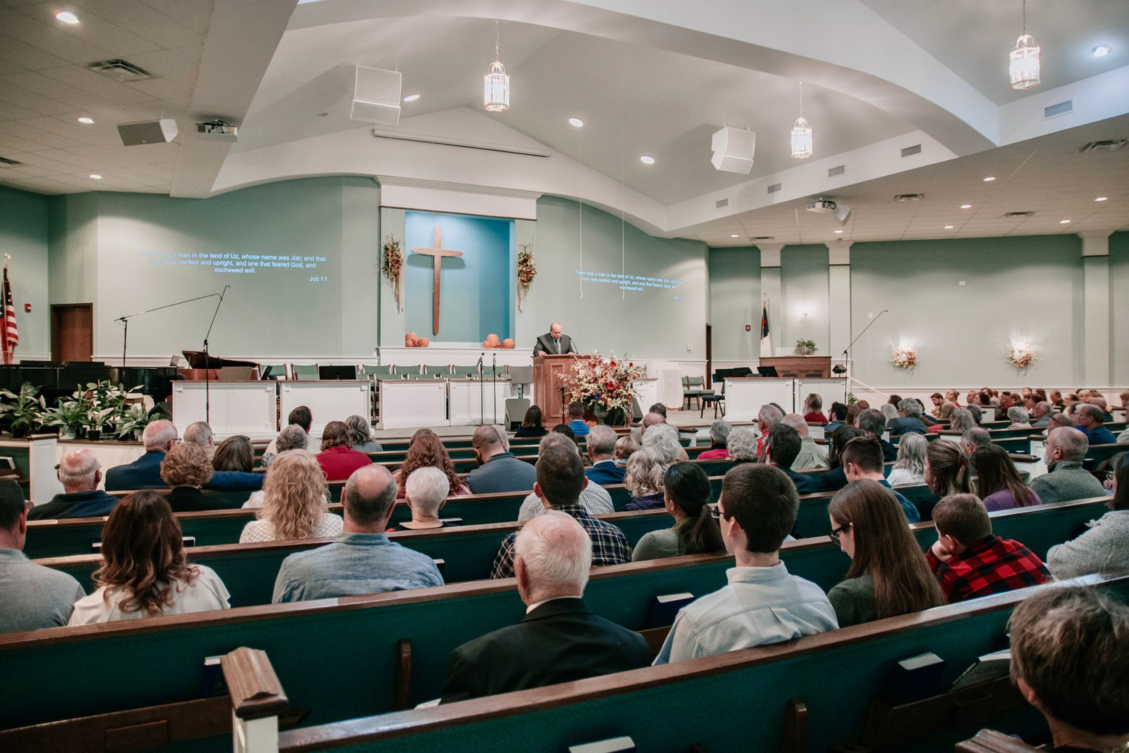 The congregation seated in the sanctuary, facing the cross