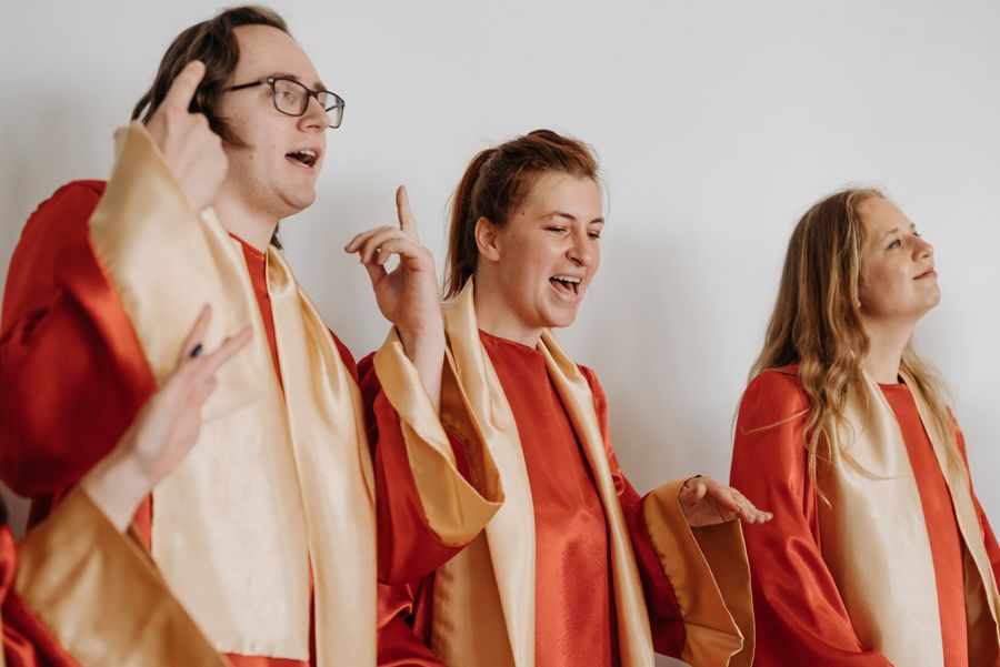 Robed choir members singing