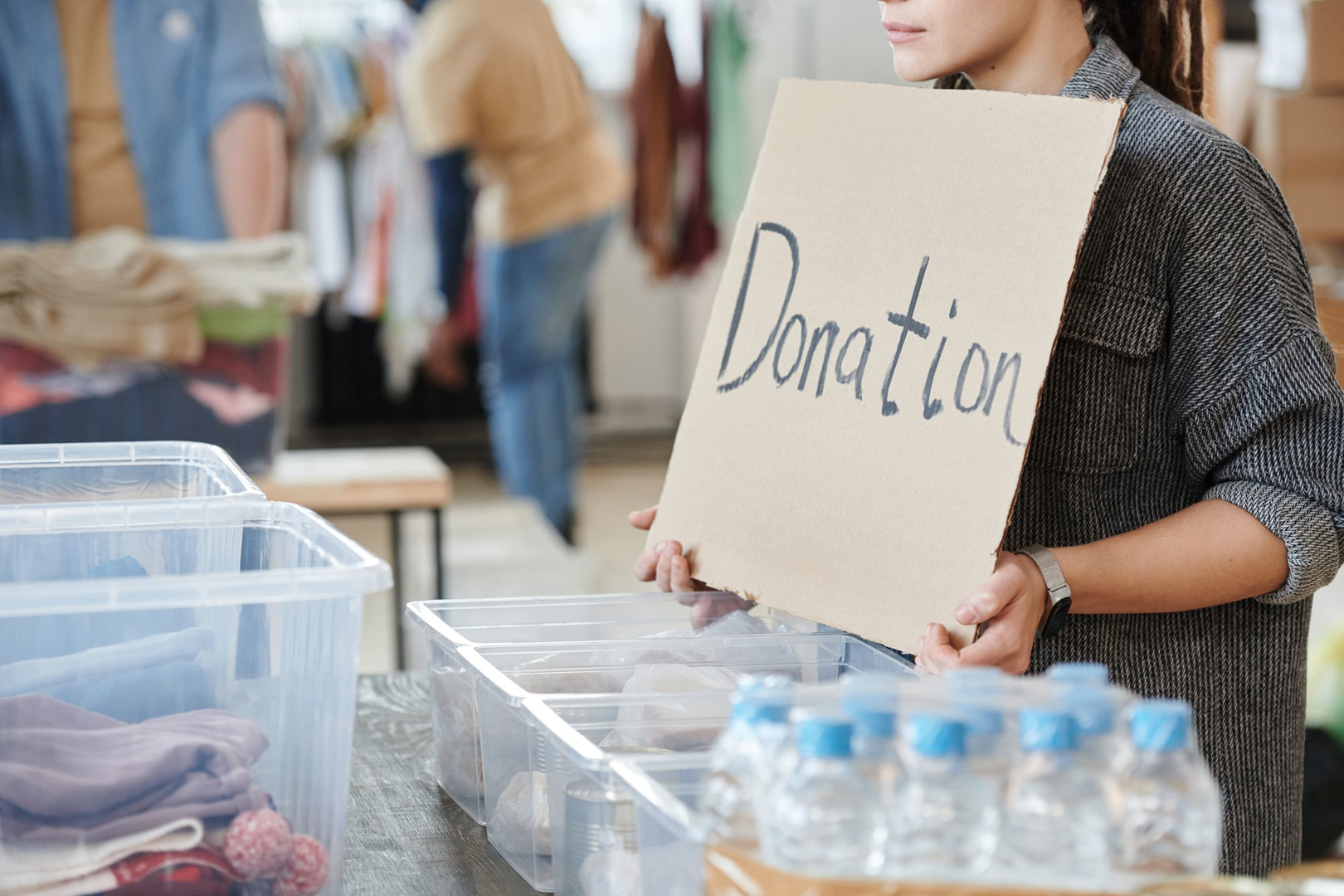 A donation sign among people gathered to give